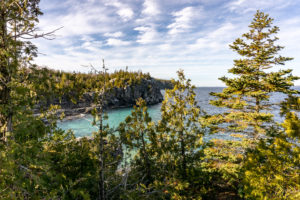 Indian Head Cove through the trees in Bruce Peninsula National Park