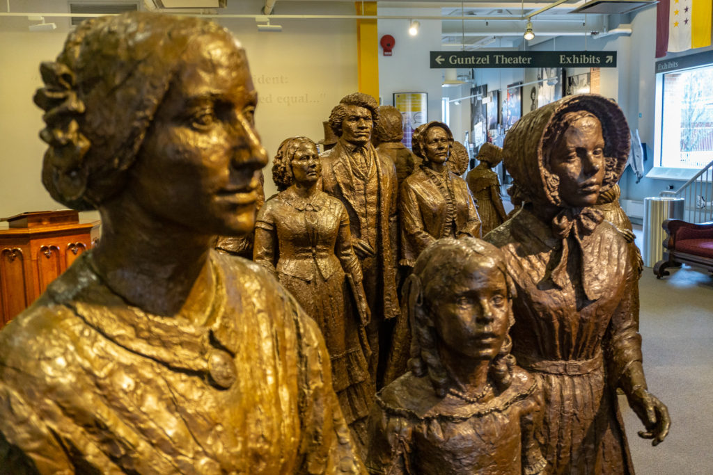"The First Wave" statue exhibit inside the Women's Rights National Historical Park Visitor Center.